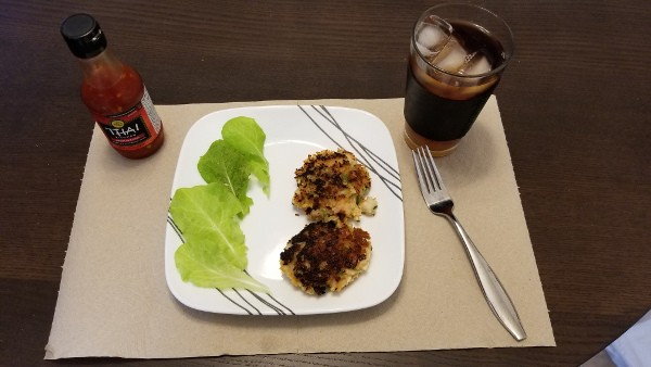 Shrimp Cakes served with lettuce leaves on a nice place setting